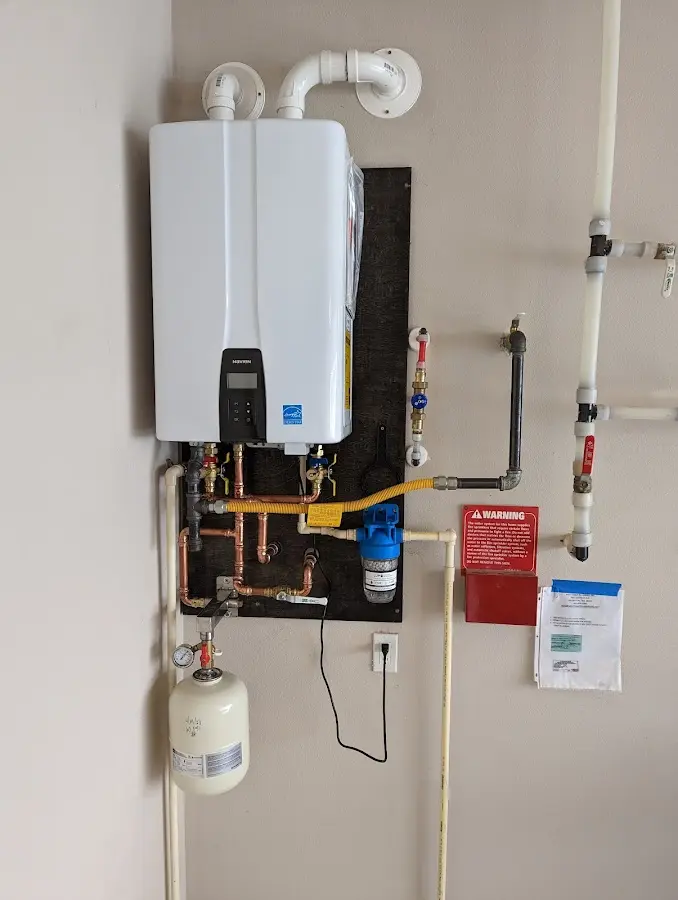 Professional plumber installing copper piping in a Buena Park home